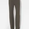 De broek met knoopsgaten De broek met knoopsgaten