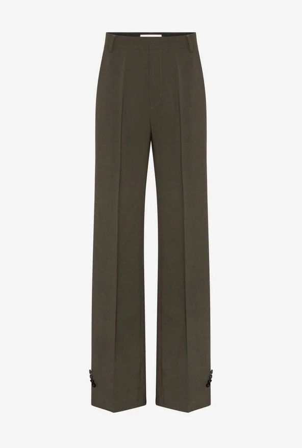 De broek met knoopsgaten De broek met knoopsgaten