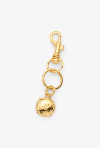 De champagne-sleutelhanger De champagne-sleutelhanger
