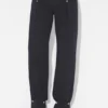 De denimjeans met drukknopen