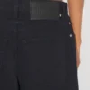 De denimjeans met drukknopen