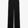 De zwarte broek met beugels De zwarte broek met beugels