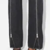De zwarte jeans met rits