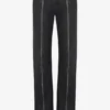 De zwarte jeans met rits