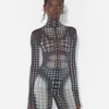 Re-Edition – de mesh top met zwart-witte stippenprint Re-Edition – de mesh top met zwart-witte stippenprint